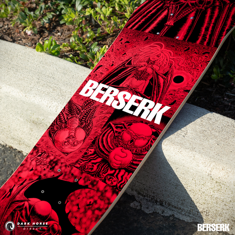 Closeup of standard variant red and black skateboard deck with 'Berserk' branding on a concrete surface.